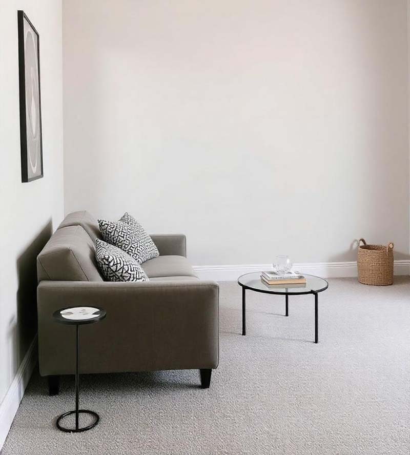 a minimal space with a neutral color for wall-to-wall carpet